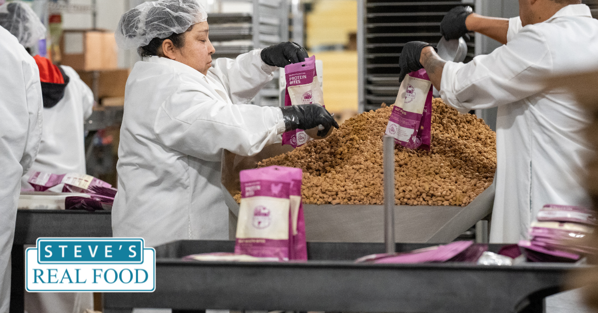 factory worker packing raw dog food