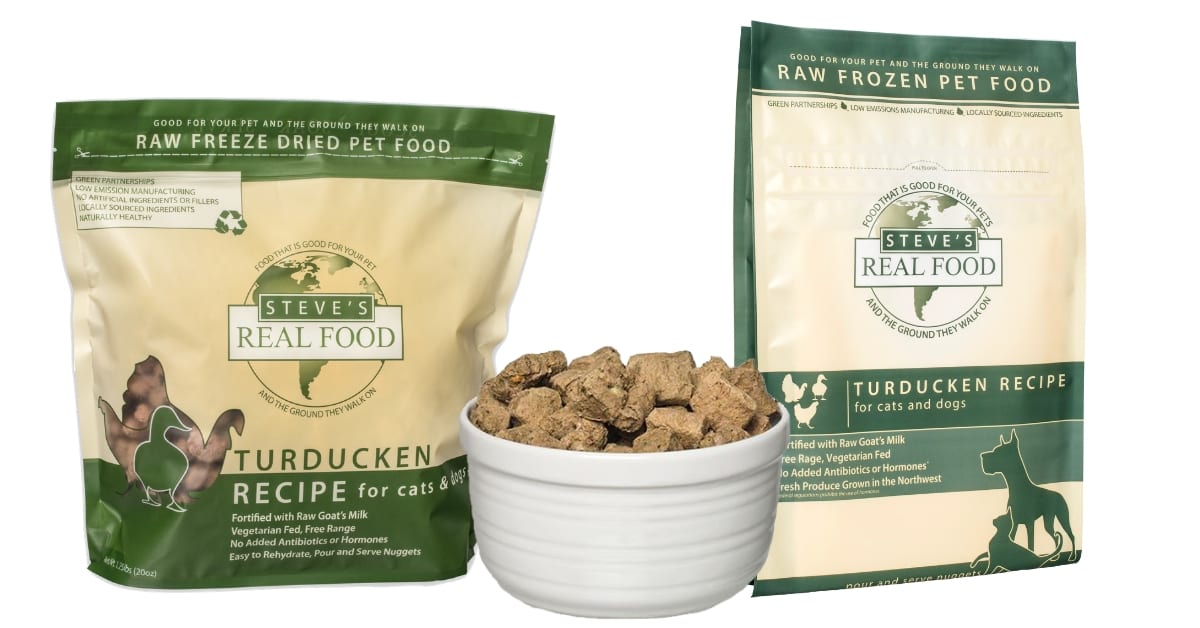 One bag of raw freeze-dried pet food turducken recipe and one bag of raw frozen pet food turducken recipe with full bowl of food