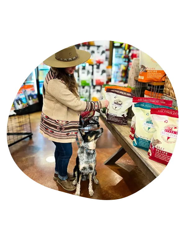 Woman with dog shopping for food