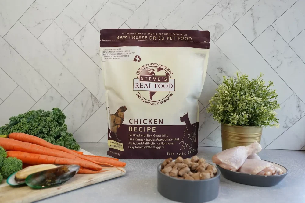 Front of bag of Raw Freeze Dried Pet Food Chicken Recipe with raw chicken and vegetables