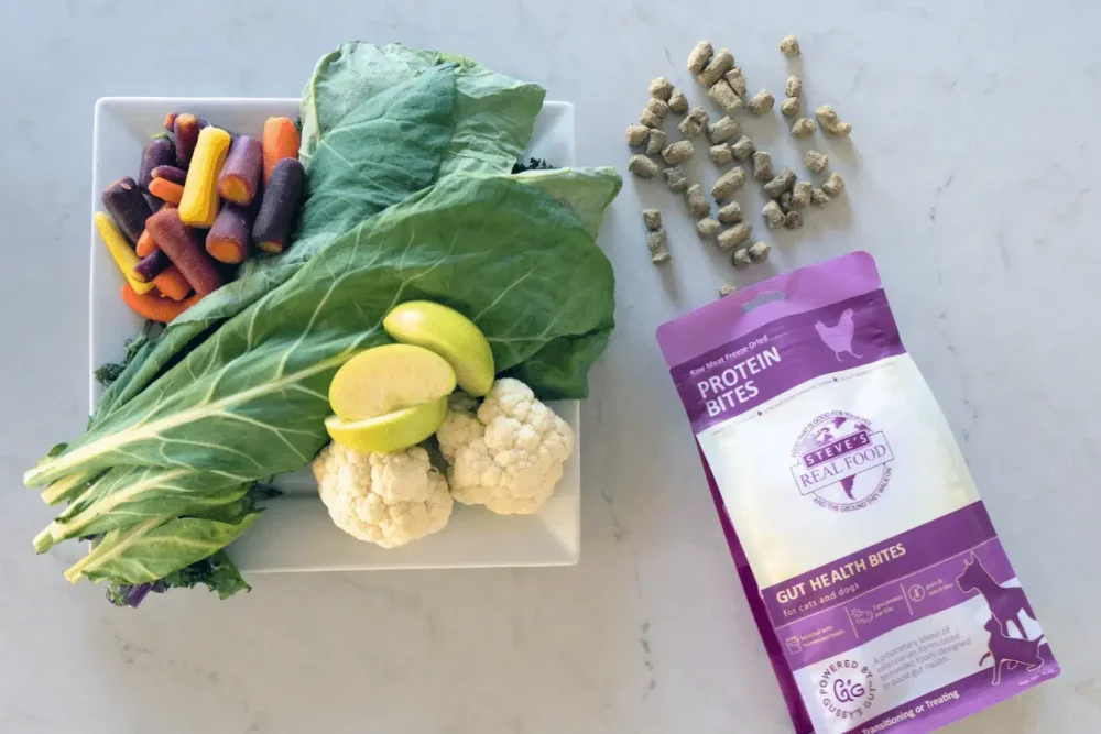 Chicken protein bites on counter with vegetables